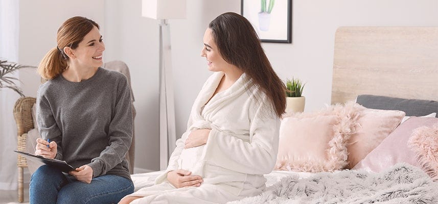 pregnant mom talking to birth professional